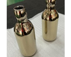 Glass bottle coated in pvd gold coating Glass bottle coated in pvd gold coating