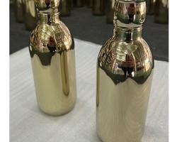 Glass bottle coated in pvd gold coating Glass bottle coated in pvd gold coating